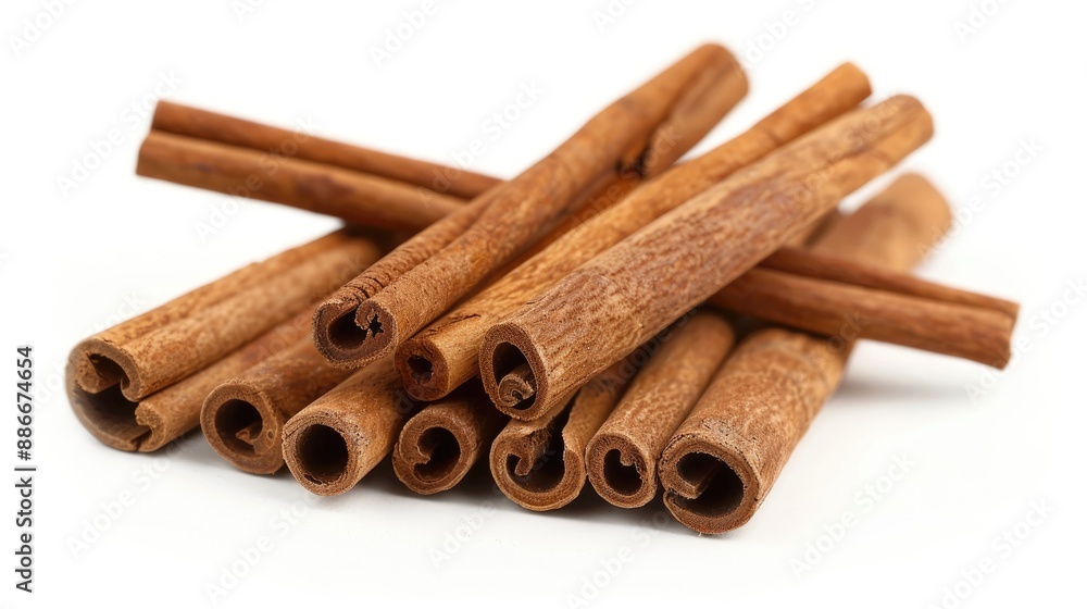 Close up of cinnamon sticks on a white backdrop Close up of cinnamon sticks on a white backdrop