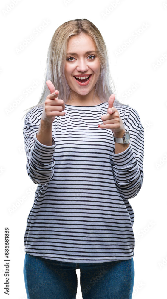 Young blonde woman over isolated background pointing fingers to camera with happy and funny face. Good energy and vibes. Young blonde woman over isolated background pointing fingers to camera with happy and funny face. Good energy and vibes.
