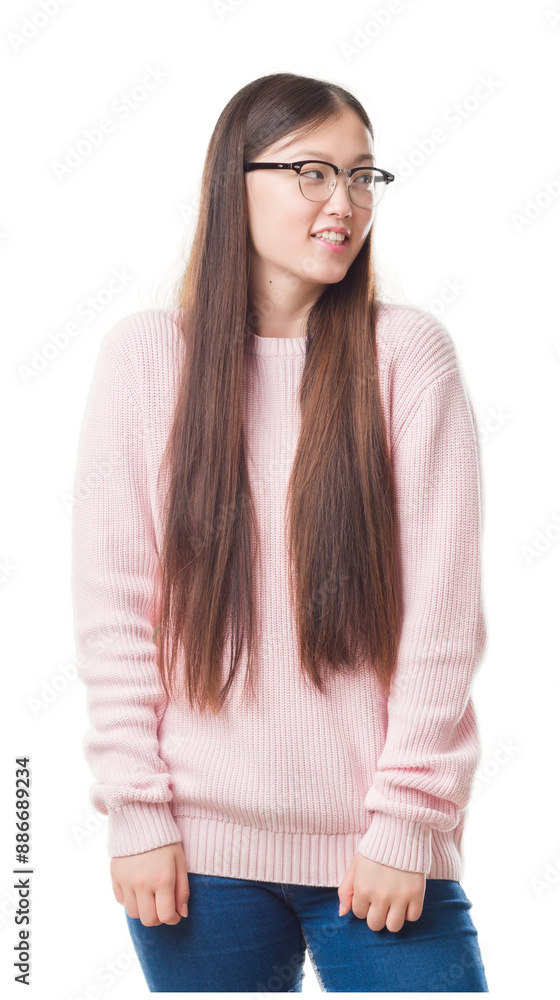 Young Chinese woman over isolated background wearing glasses looking away to side with smile on face, natural expression. Laughing confident. Young Chinese woman over isolated background wearing glasses looking away to side with smile on face, natural expression. Laughing confident.