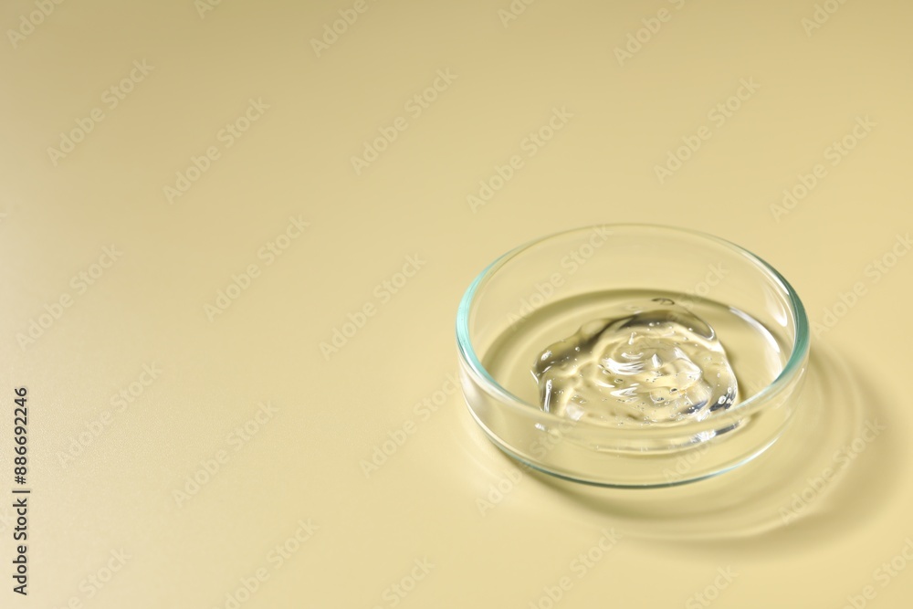 Petri dish with sample on beige background, space for text Petri dish with sample on beige background, space for text