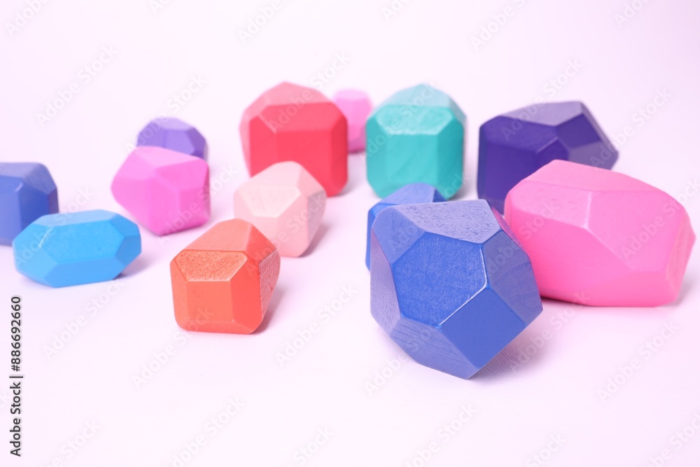 Many colorful balancing stones on white background Many colorful balancing stones on white background