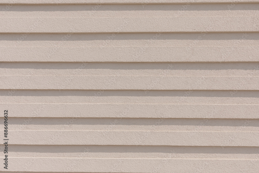 Fototapeta premium Beige Textured Wall with Horizontal Lines for Background or Architectural Design
