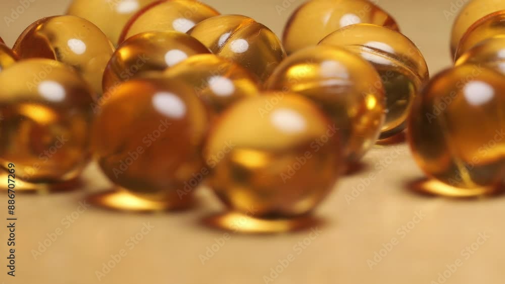 Close-up of yellow omega 3 gel capsule,Fish oil supplement,vitamin E,Concept of Healthy Living,4k footage Close-up of yellow omega 3 gel capsule,Fish oil supplement,vitamin E,Concept of Healthy Living,4k footage