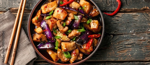 Stir fried Chinese meal featuring eggplant and pork with a copy space image