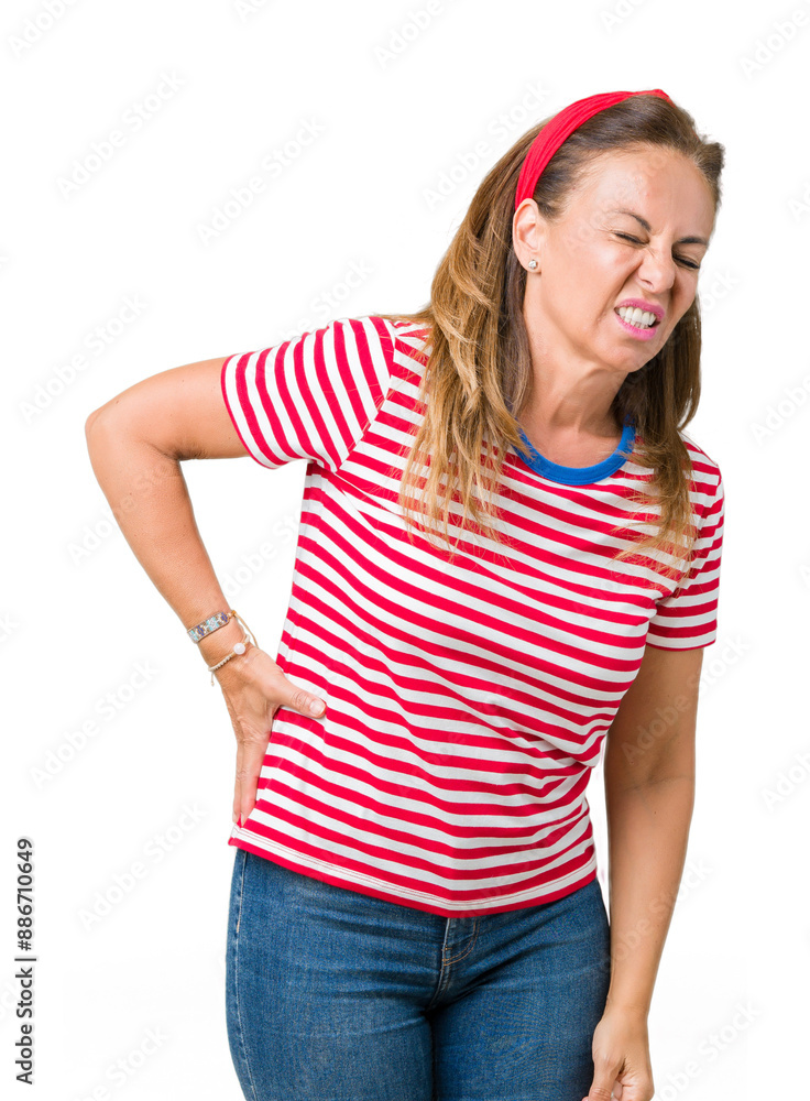 Beautiful middle age woman wearing casual stripes t-shirt over isolated background Suffering of backache, touching back with hand, muscular pain Beautiful middle age woman wearing casual stripes t-shirt over isolated background Suffering of backache, touching back with hand, muscular pain