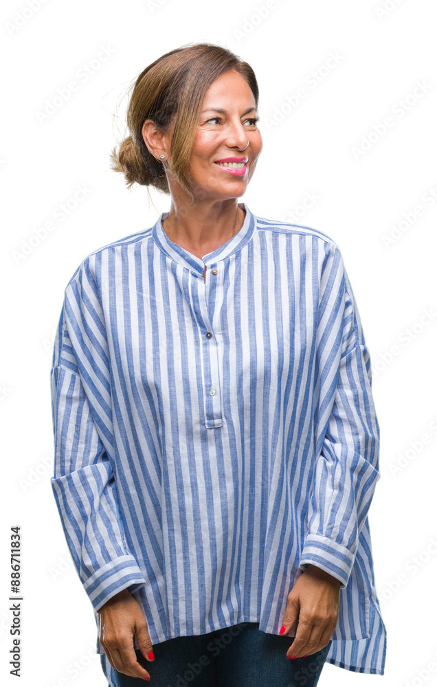 Middle age senior hispanic woman over isolated background looking away to side with smile on face, natural expression. Laughing confident. Middle age senior hispanic woman over isolated background looking away to side with smile on face, natural expression. Laughing confident.