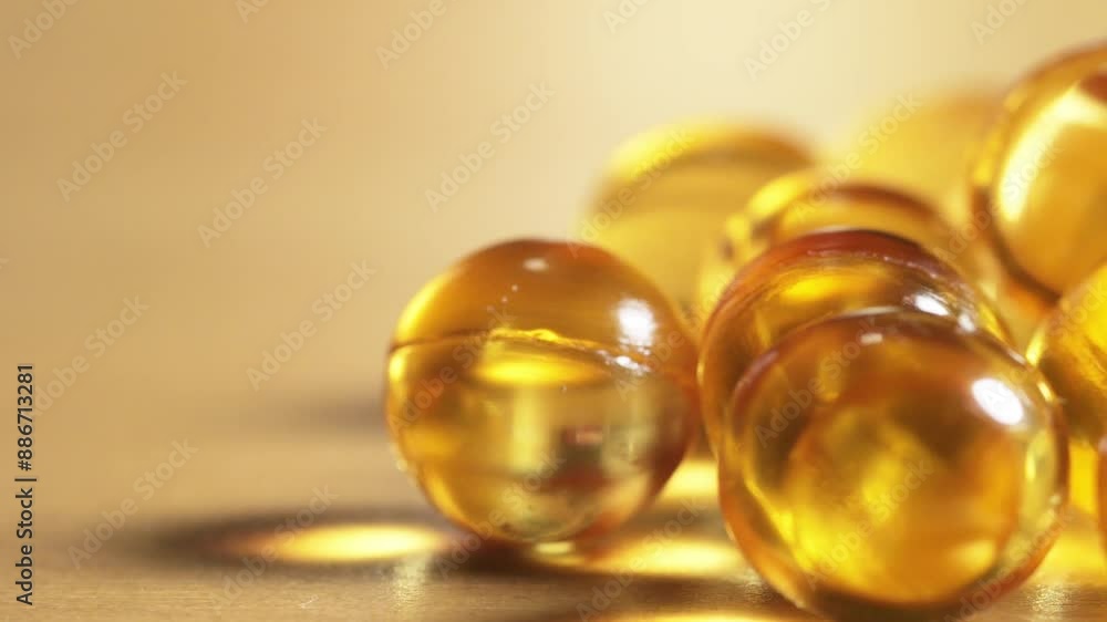 Close-up of yellow omega 3 gel capsule,Fish oil supplement,vitamin E,Concept of Healthy Living,4k footage Close-up of yellow omega 3 gel capsule,Fish oil supplement,vitamin E,Concept of Healthy Living,4k footage