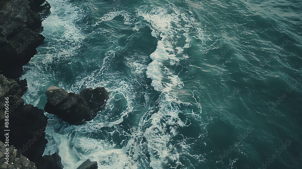 Obraz premium Bird's-eye view of serene ocean waves by a rugged rocky shore, in sea green and creamy tan, ultra HD, minimalist and clean