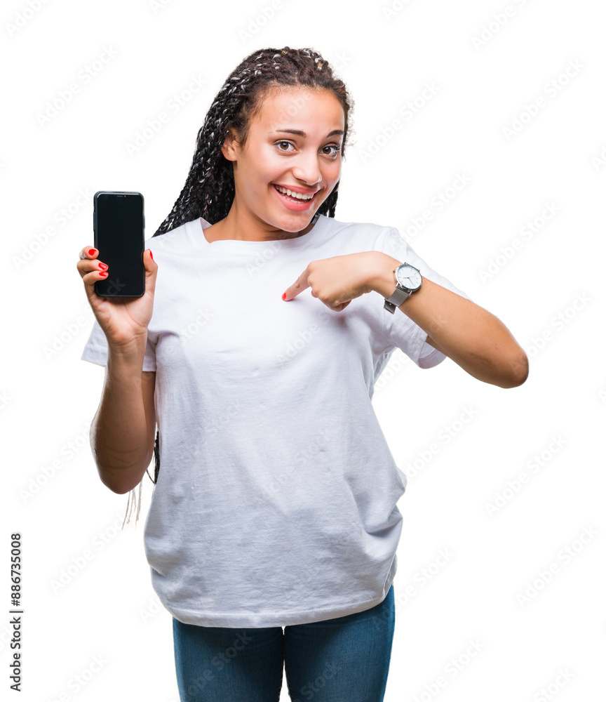 Young braided hair african american girl showing screen of smartphone over isolated background with surprise face pointing finger to himself Young braided hair african american girl showing screen of smartphone over isolated background with surprise face pointing finger to himself