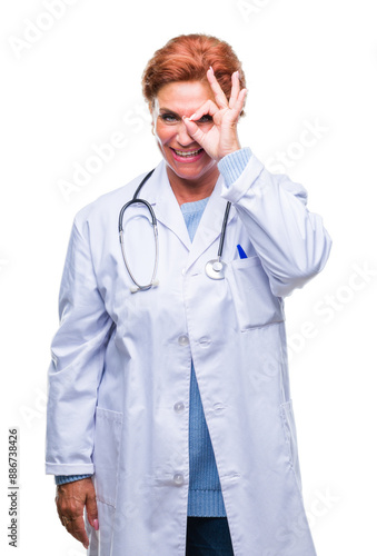 Senior caucasian doctor woman wearing medical uniform over isolated background doing ok gesture with hand smiling, eye looking through fingers with happy face.