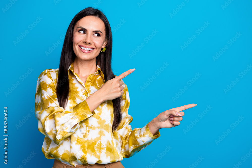 Photo of adorable elegant lovely woman wear trendy clothes look empty space proposition isolated on blue color background Photo of adorable elegant lovely woman wear trendy clothes look empty space proposition isolated on blue color background
