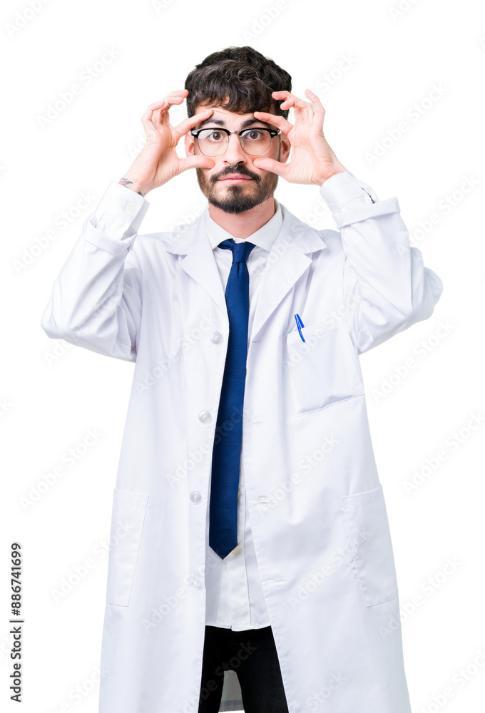 Young professional scientist man wearing white coat over isolated background Trying to open eyes with fingers, sleepy and tired for morning fatigue Young professional scientist man wearing white coat over isolated background Trying to open eyes with fingers, sleepy and tired for morning fatigue