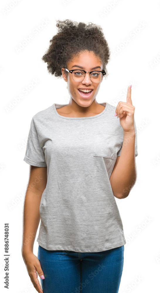Young afro american woman wearing glasses over isolated background pointing finger up with successful idea. Exited and happy. Number one. Young afro american woman wearing glasses over isolated background pointing finger up with successful idea. Exited and happy. Number one.