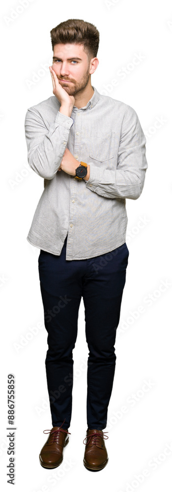 Young handsome man wearing casual shirt thinking looking tired and bored with depression problems with crossed arms. Young handsome man wearing casual shirt thinking looking tired and bored with depression problems with crossed arms.
