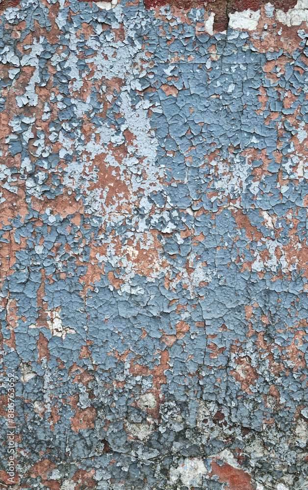 Texture of old rustic wall covered with gray and blue stucco. Multilayers of old paint on the wall. Textured background. Texture of old rustic wall covered with gray and blue stucco. Multilayers of old paint on the wall. Textured background.