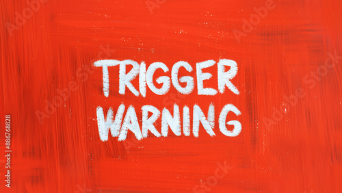 Red background trigger warning sign. Mental triggering concept. photo