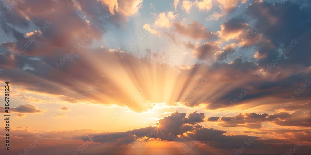 Fototapeta premium Vivid sunset with sun rays peeking through dramatic colorful clouds. Concept Sunset photography, Sun rays, Dramatic clouds, Colorful sky, Vivid colors