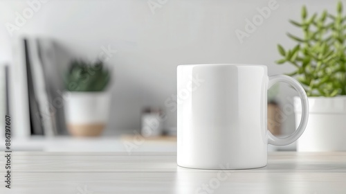 White coffee mug on a wooden table with a blurred background.