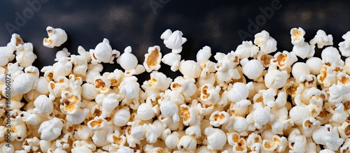 A gray surface showcasing popcorn with ample copy space image. photo