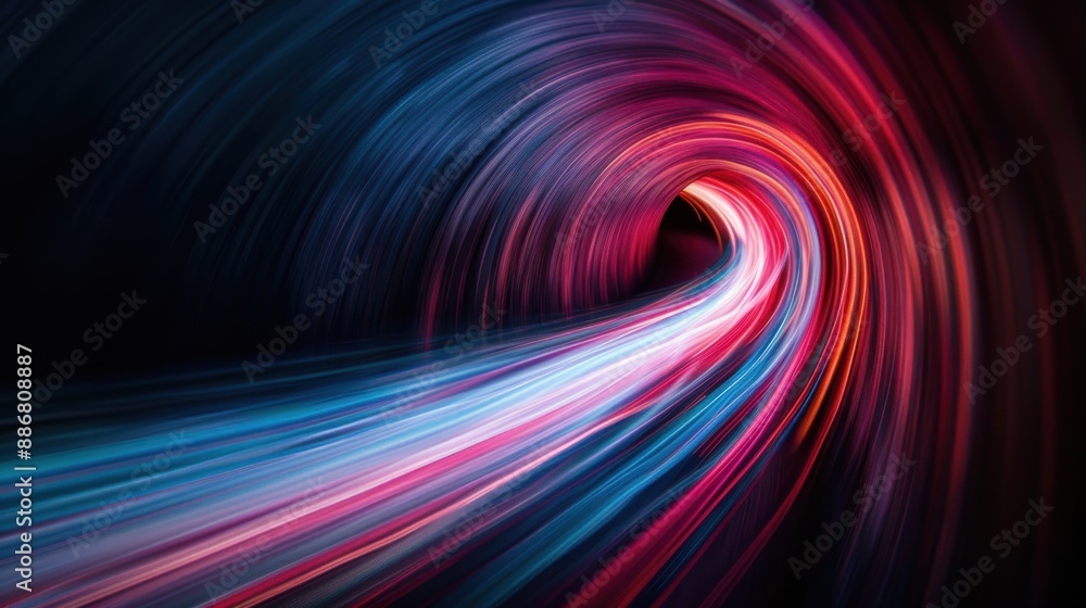Obraz premium This image shows a tunnel filled with vibrant trails of pink and blue light, creating a captivating sense of movement and futuristic design, set in a dark abstract landscape.