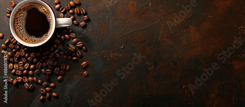 Coffee cup and beans in a top-down view with ample copy space image for text. photo