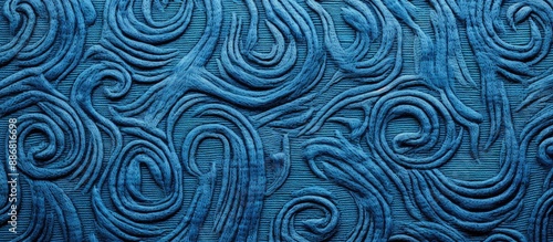 Close-up image of a blue wool texture with intricate needlework on a natural fabric background, conveying a handmade concept with copy space image.