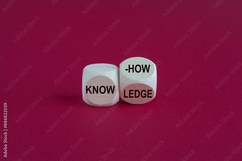 To have know-how or to have knowledge Businessman turns a cube and changes the word know-how to knowledge. Beautiful pink background.