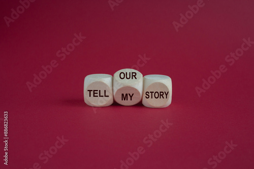 Obraz na płótnie Tell my or our story. Turned a wooden cube and changed words tell my story to tell our story. Beautiful pink background. Business, storytelling and my or our story concept. w salonie