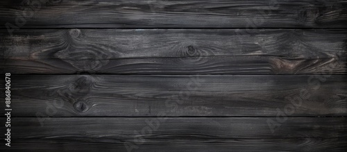 Rustic dark wooden texture with an old black and grey color palette creating a captivating wood background, perfect for a copy space image.