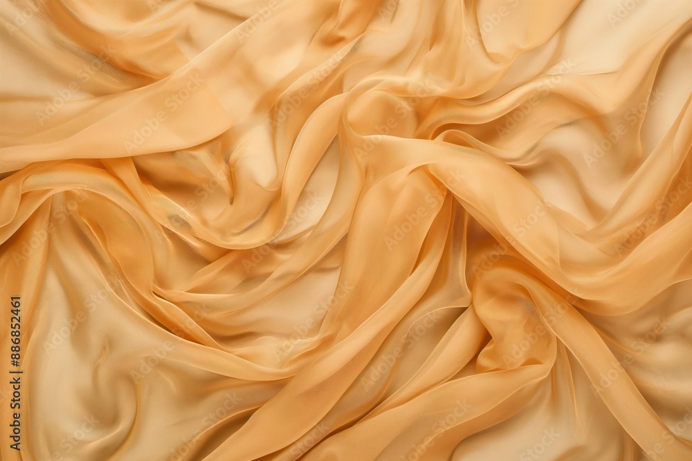 Fototapeta premium Close-up of crumpled orange fabric with textured surface. Soft focus on material, blurred background creates depth. Perfect for textile design, fashion, and interior decoration projects.