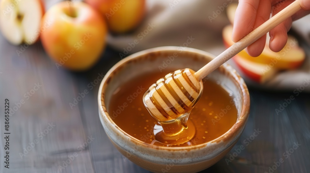 Jewish New Year tradition: Hands dipping apples in honey. Jewish New Year tradition: Hands dipping apples in honey.