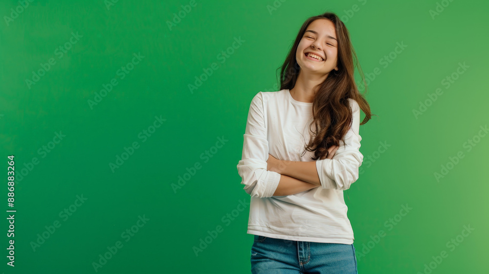 photo of smiling happy girl in front of green background photo of smiling happy girl in front of green background