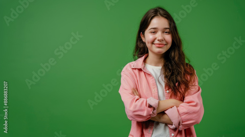 photo of smiling happy girl in front of green background © Cedric
