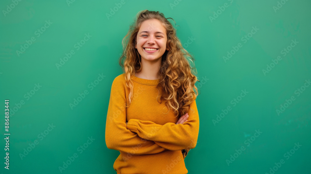 photo of smiling happy girl in front of green background photo of smiling happy girl in front of green background