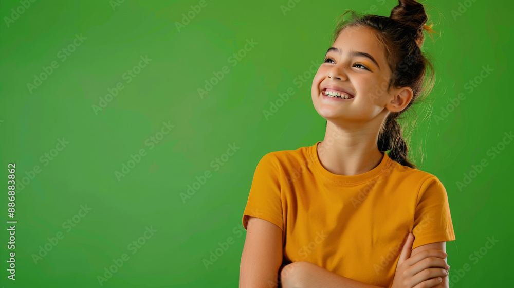 photo of smiling happy girl in front of green background photo of smiling happy girl in front of green background