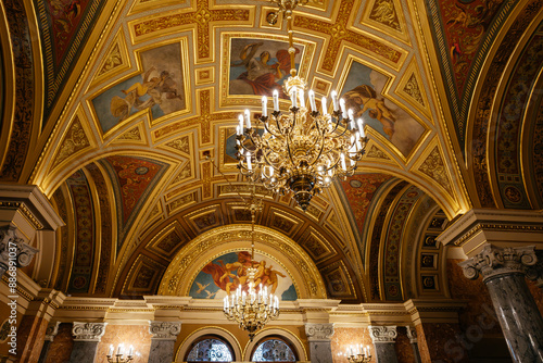 Budapest, Hungary May, 18 2024. A symmetrical, circular pattern of wide angle view on a ceiling of Opera house in Hungary. Interior details of the Hungarian State Opera in Budapest