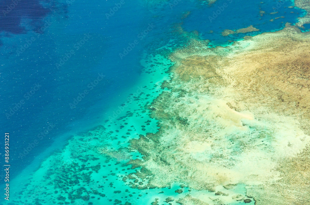 Fototapeta premium Spectacular aerial view on Great Barrier Reef on the way from Cairns to Lizard Island, Queensland, Australia. Great Barrier Reef¬†is the worlds largest coral reef system.