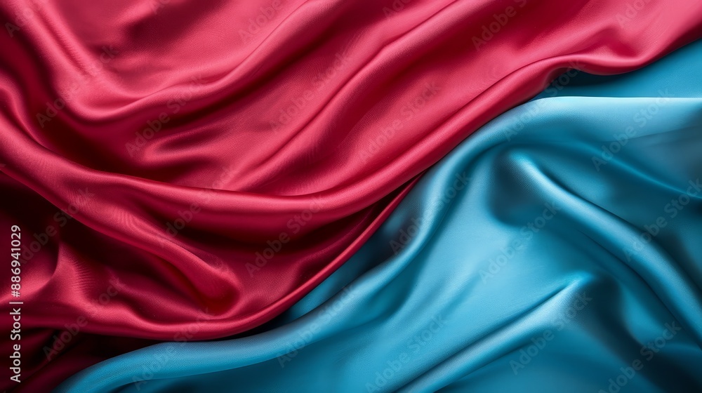 Fototapeta premium A close-up of red, blue, and pink silk material with diagonal patterns