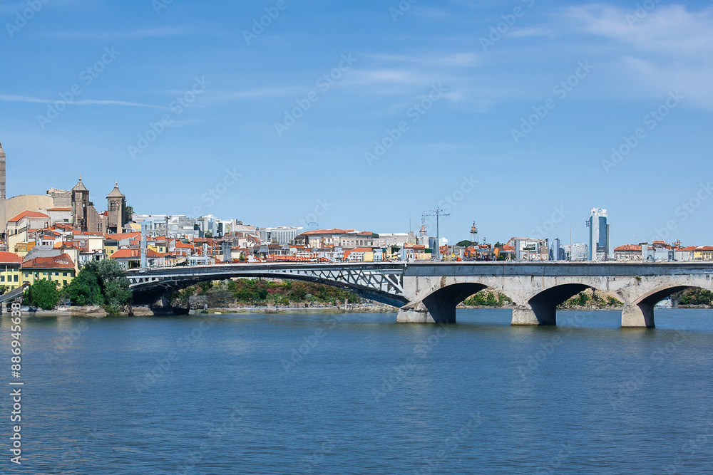 Movement of people and communication between cities. Travel landscape concept. A city stands on water under bridge. A bridge stands in water between cities lifestyle to facilitate communication Movement of people and communication between cities. Travel landscape concept. A city stands on water under bridge. A bridge stands in water between cities lifestyle to facilitate communication