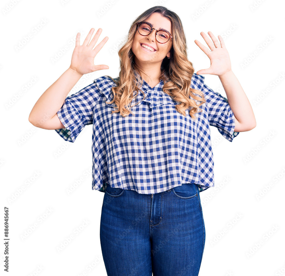 Young caucasian woman wearing casual clothes showing and pointing up with fingers number ten while smiling confident and happy. Young caucasian woman wearing casual clothes showing and pointing up with fingers number ten while smiling confident and happy.