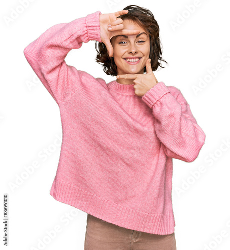 Young hispanic woman wearing casual clothes smiling making frame with hands and fingers with happy face. creativity and photography concept.