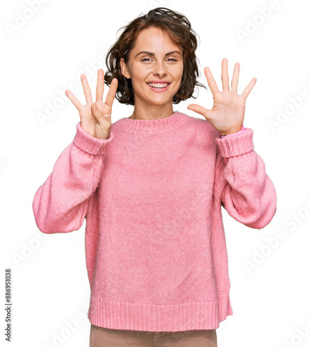 Young hispanic woman wearing casual clothes showing and pointing up with fingers number nine while smiling confident and happy.