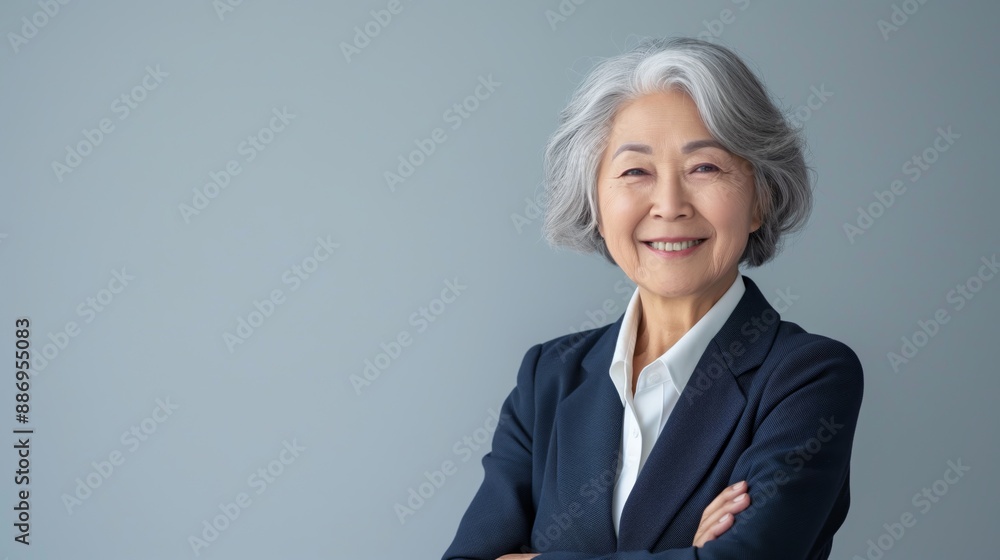 Confident Elderly Indonesian Businesswoman in Professional Attire, Ideal for Business and Leadership Concepts