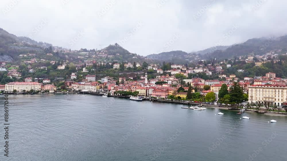 Italian Menaggio town on shore lake Como with overcast day. Aerial view Italian Menaggio town on shore lake Como with overcast day. Aerial view