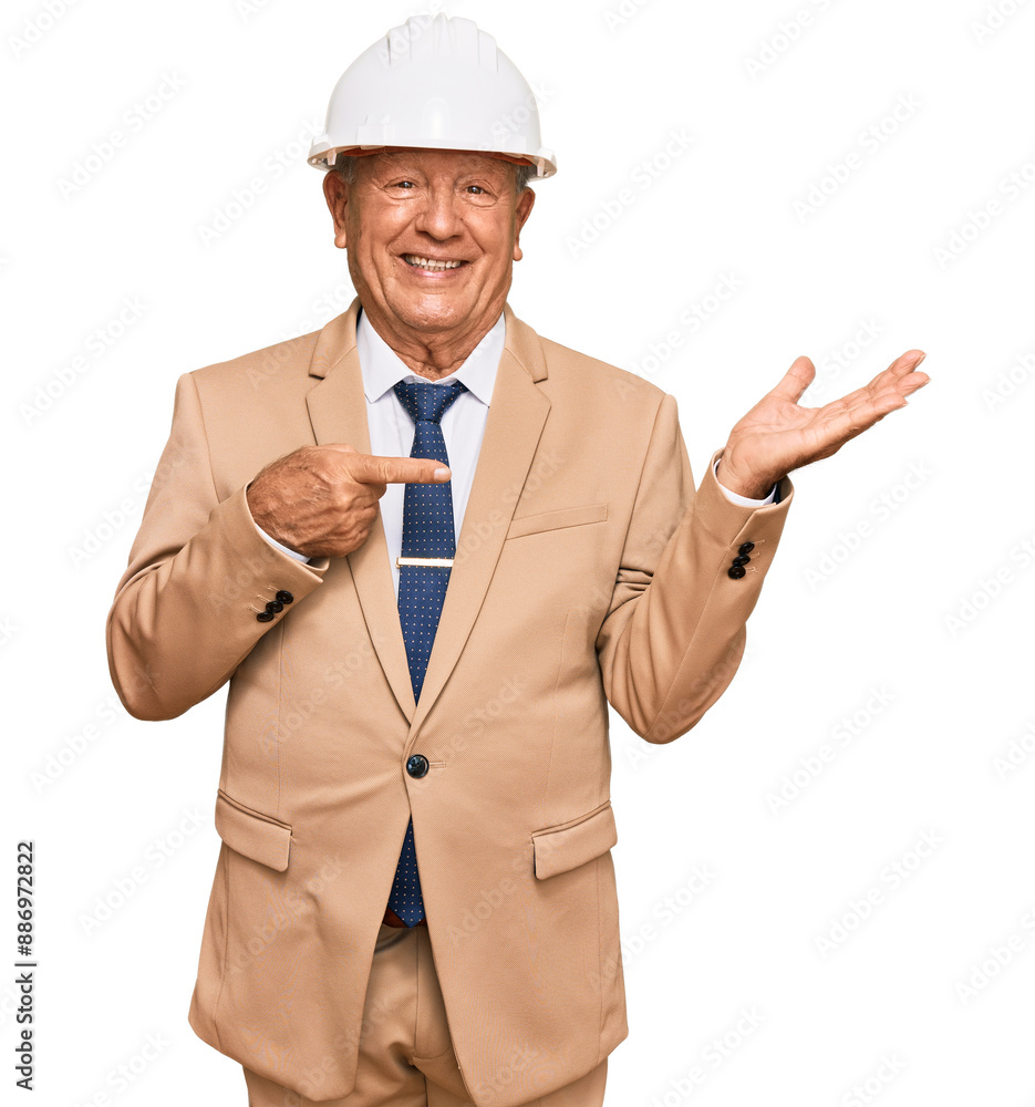 Senior caucasian man wearing architect hardhat amazed and smiling to the camera while presenting with hand and pointing with finger. Senior caucasian man wearing architect hardhat amazed and smiling to the camera while presenting with hand and pointing with finger.