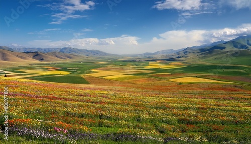 Expansive Plateau with Vibrant Flower Fields and Distant Mountain Range. Generative AI