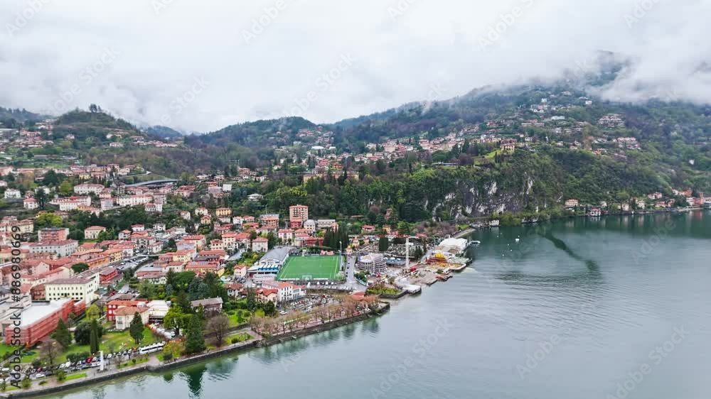 Menaggio historic cultural town on Lake Como, from above on a cloudy day. Aerial drone footage Menaggio historic cultural town on Lake Como, from above on a cloudy day. Aerial drone footage