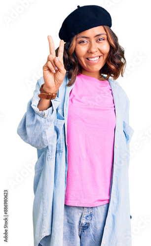 Young beautiful mixed race woman wearing french look with beret showing and pointing up with fingers number two while smiling confident and happy.