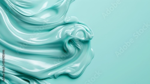  A tight shot of a blue liquid's textured surface against a light green backdrop Soft tactility imbues the scene
