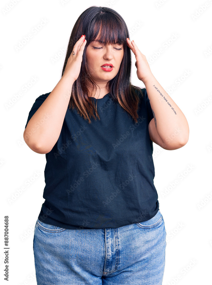 Young plus size woman wearing casual clothes with hand on head for pain in head because stress. suffering migraine. Young plus size woman wearing casual clothes with hand on head for pain in head because stress. suffering migraine.
